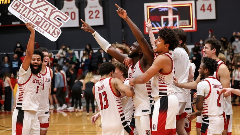 Seattle University players celebrate after they beat Chicago State in...