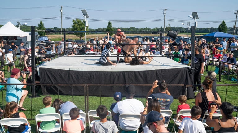 Some of the pro wrestling action at LuchaRumble on Sunday. The event...
