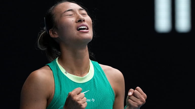 Zheng Qinwen of China celebrates after defeating compatriot Wang Yafan...