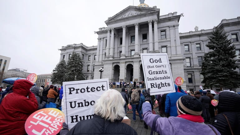 Attendees protest the one-year anniversary of Colorado's abortion law, the...