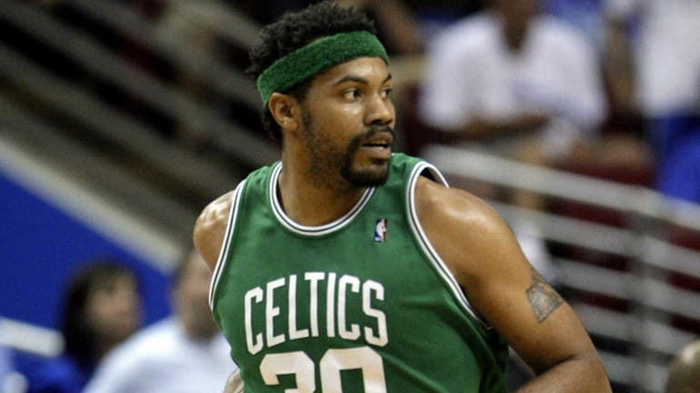 Boston Celtics center Rasheed Wallace runs down the court after...