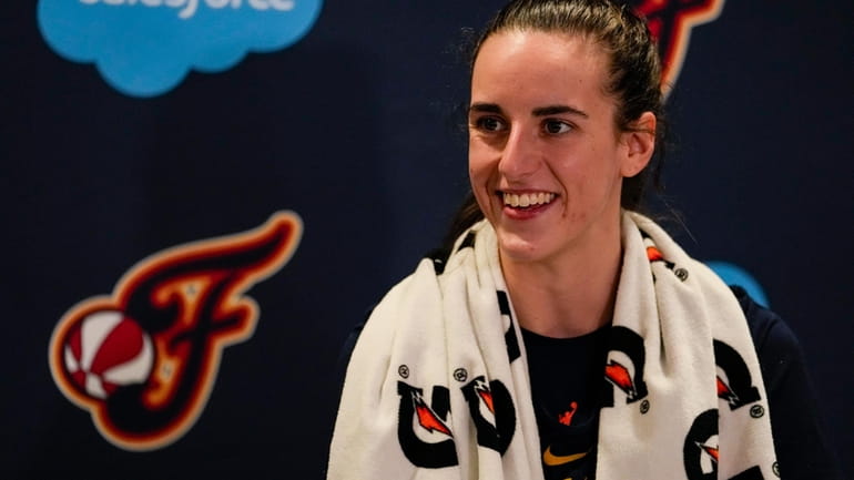 Indiana Fever guard Caitlin Clark speaks with the media after...