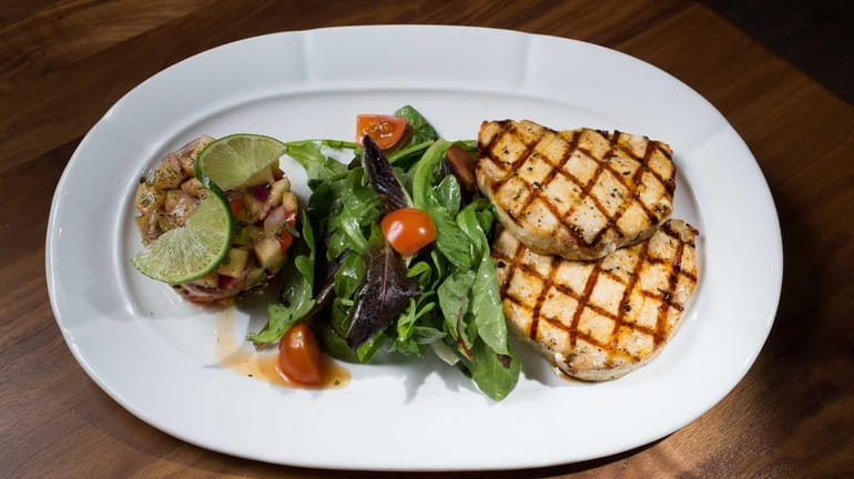 Grilled swordfish marinated in light Turkish spices is served with...