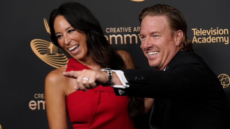 HGTV stars Joanna Gaines, left, and Chip Gaines, pose in...