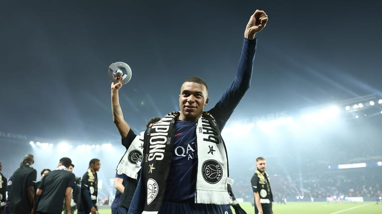 PSG's Kylian Mbappe celebrates PSG's French League One title after...