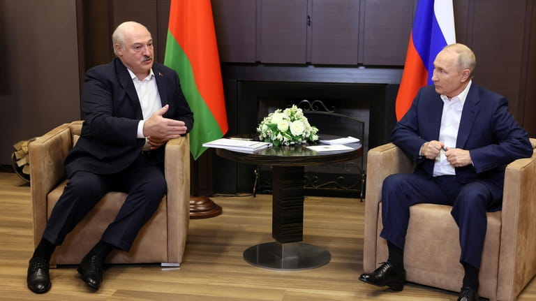 Russian President Vladimir Putin, right, and Belarusian President Alexander Lukashenko...