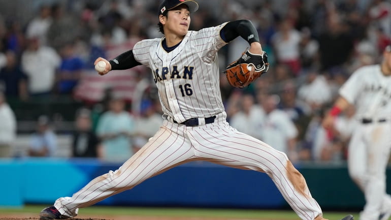 Japan pitcher Shohei Ohtani (16) aims a pitch during the...