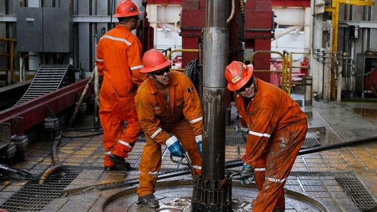 Pemex oil workers set the drill on the Centenario deep-water...