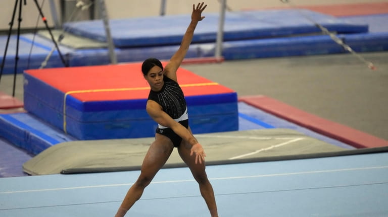 Gabby Douglas performs her floor routine while competing at the...
