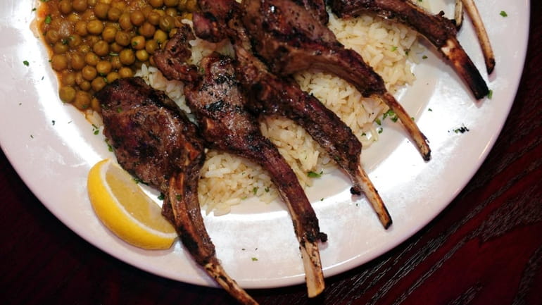 The grilled lamb chops are served with a choice of...