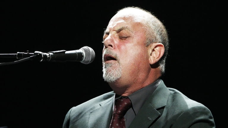 Singer/musician Billy Joel performs onstage at the Honda Center on...