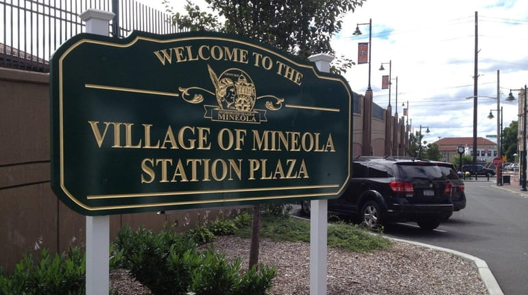Mineola's existing parking lots must accommodate commuters boarding trains at...