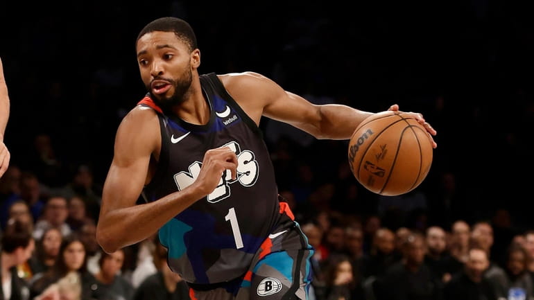 Mikal Bridges #1 of the Brooklyn Nets drives to the...