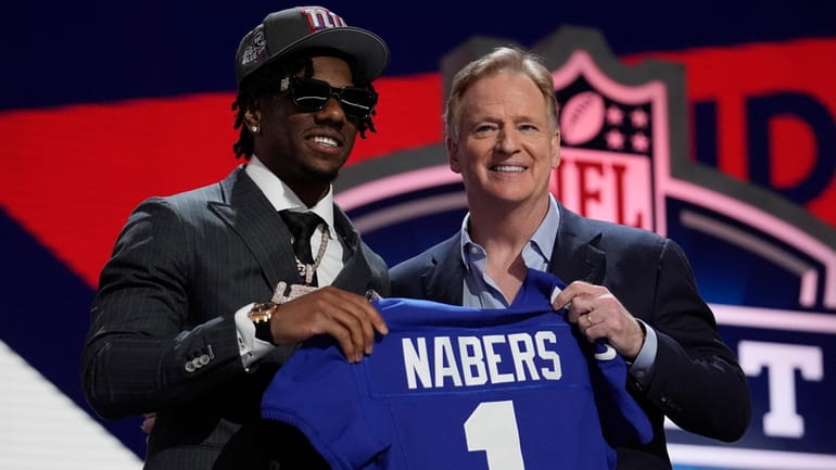 LSU wide receiver Malik Nabers, left, poses with NFL Commissioner...