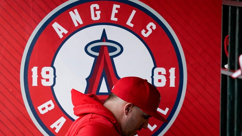 Los Angeles Angels center fielder Mike Trout leaves the dugout...