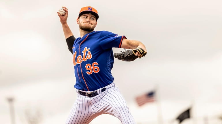 New York Mets pitcher Christian Scott throws during a spring...