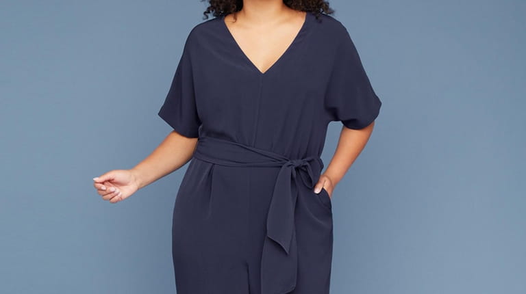 This crepe jumpsuit with a V-neck has graceful Dolman sleeves...