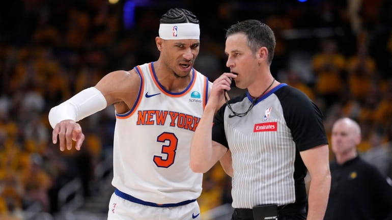 Knicks guard Josh Hart questions a call with referee Kevin Scott during...