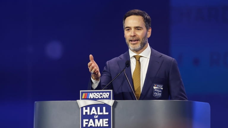 Jimmie Johnson speaks during his induction into the NASCAR Hall...