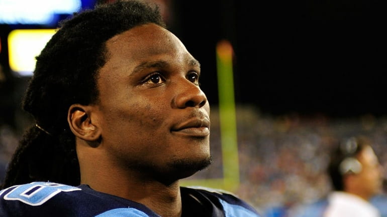 Chris Johnson #28 of the Tennessee Titans watches from the...