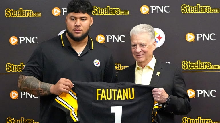 Pittsburgh Steelers first round draft pick Troy Fantanu, left, and...