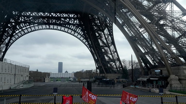 Unions flags are pictured at the Eiffel Tower, Tuesday, Feb....