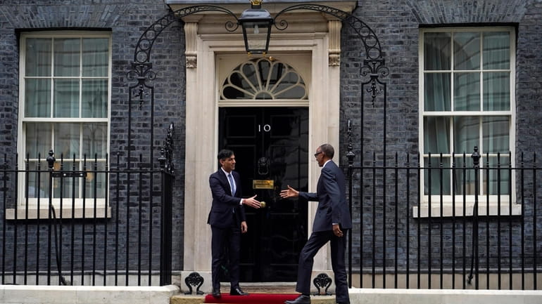 Britain's Prime Minister Rishi Sunak, left, greets the President of...