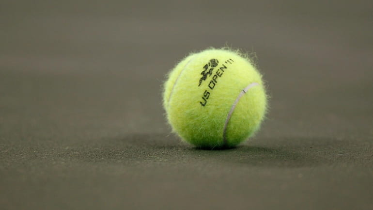 A tennis ball on the court during the first round...