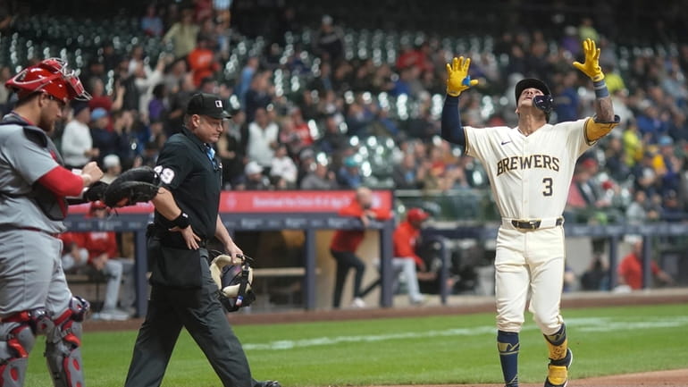 Milwaukee Brewers' Joey Ortiz reacts after hitting a home run...