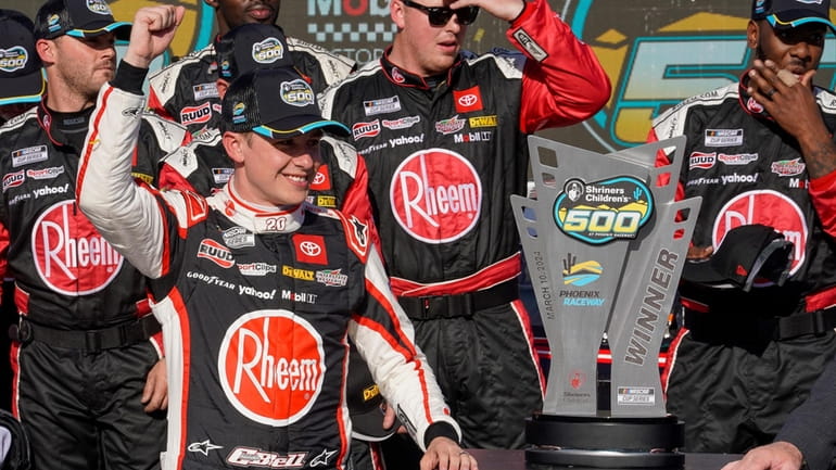 Christopher Bell celebrates his NASCAR Cup Series win at Phoenix...