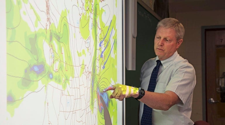 Science teacher Ken Ohrtman includes looking at an active hurricane...