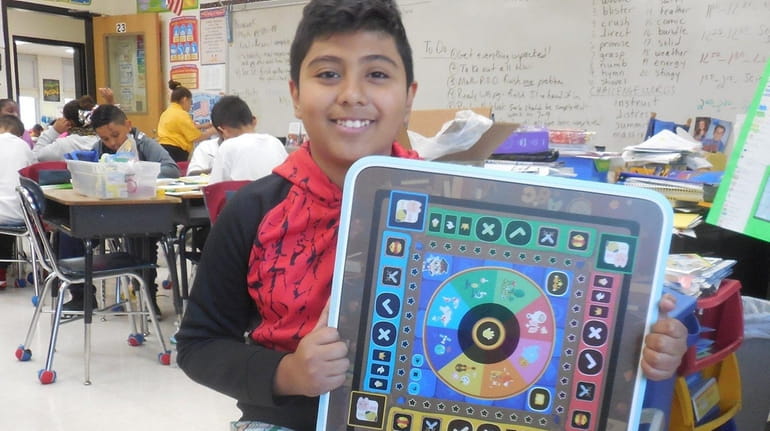 Kidsday reporter Daniel Trejo-Ramirez with the Beyond Tablet and his...