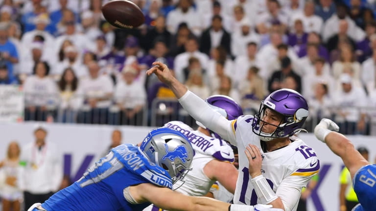Minnesota Vikings quarterback Nick Mullens (12) passes as he is...