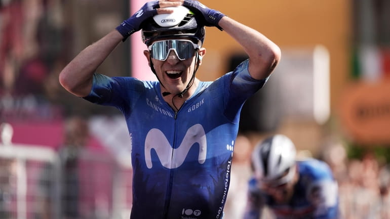 Spain's Pelayo Sanchez celebrates winning the sixth stage of the...