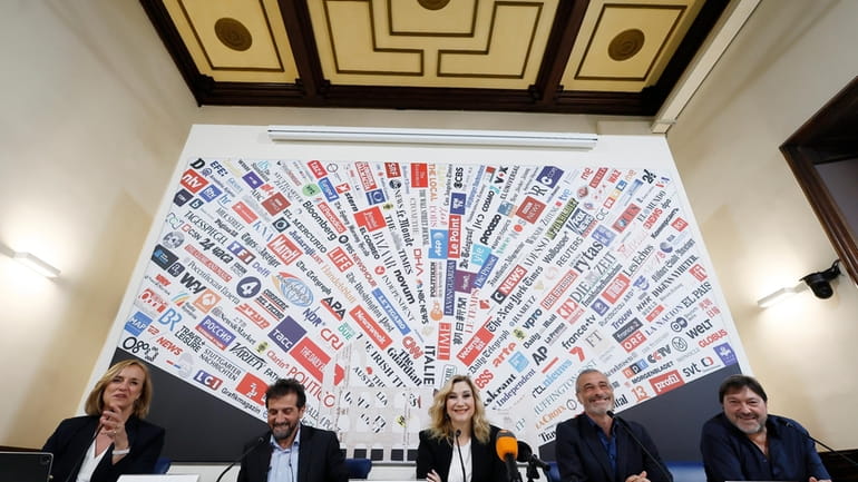 From left, Italian Foreign Press Association's member Costanze Reuscher hosts...