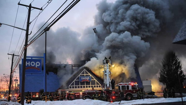 A spectacular fire at daybreak Saturday damaged the IHOP restaurant...