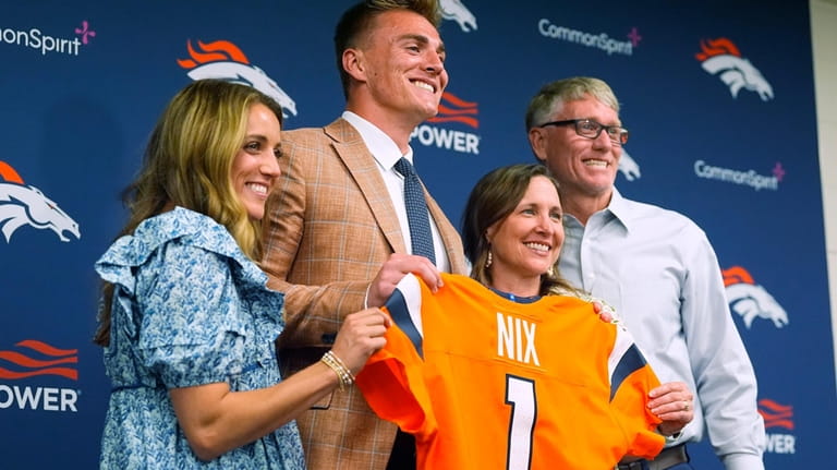 Denver Broncos draft pick quarterback Bo Nix, second from left;...