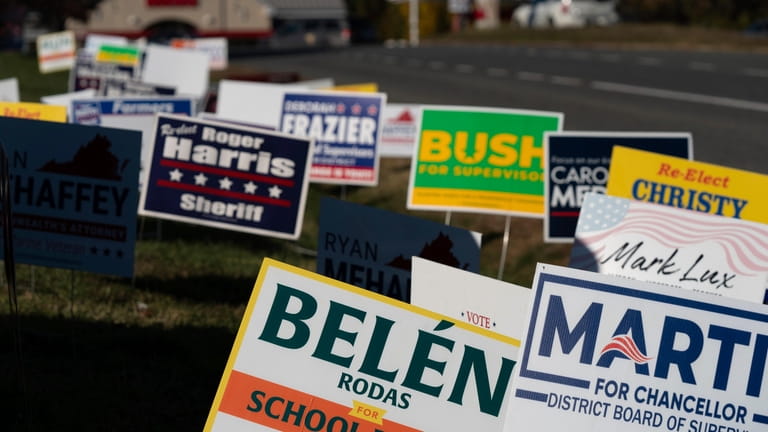 Candidate signs are seen at the Spotsylvania county early voting...