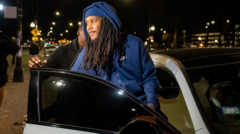Darien Harris gets inside his wife's vehicle outside Cook County...