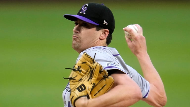 Colorado Rockies starting pitcher Cal Quantrill delivers during the first...