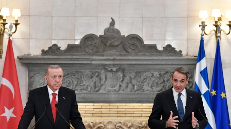 Greece's Prime Minister Kyriakos Mitsotakis, right, makes statements with Turkey's...