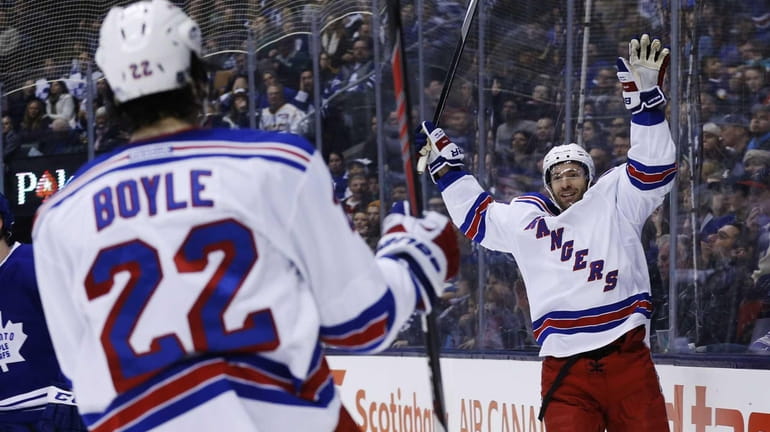 Rangers' Dominic Moore celebrates his goal against the Toronto Maple...