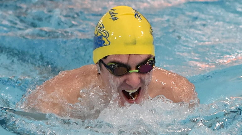 Brett Powell of West Islip surfaces during the breaststroke portion...
