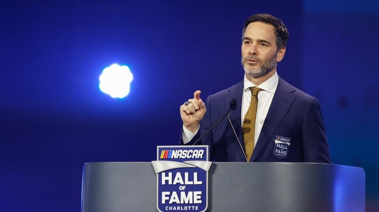 Jimmie Johnson speaks at his induction into the NASCAR Hall...
