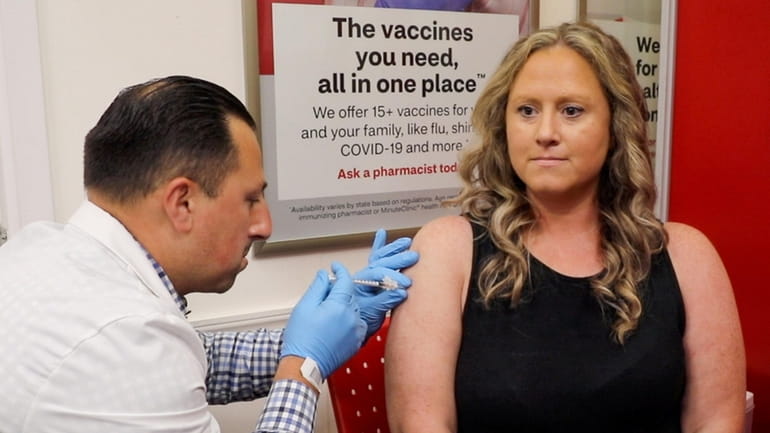 Theresa Watt from East Meadow recieves the newest COVID-19 vaccine...