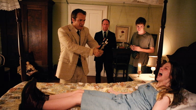"The Last Exorcism": foreground: Ashley Bell, rear l-r: Patrick Fabian, Louis...