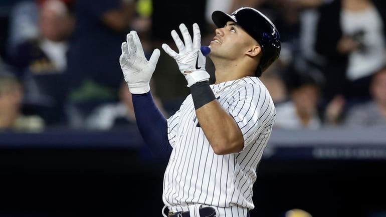 Jasson Dominguez #89 of the New York Yankees celebrates his...
