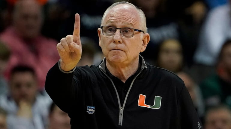 Miami head coach Jim Larranaga gestures in the first half...