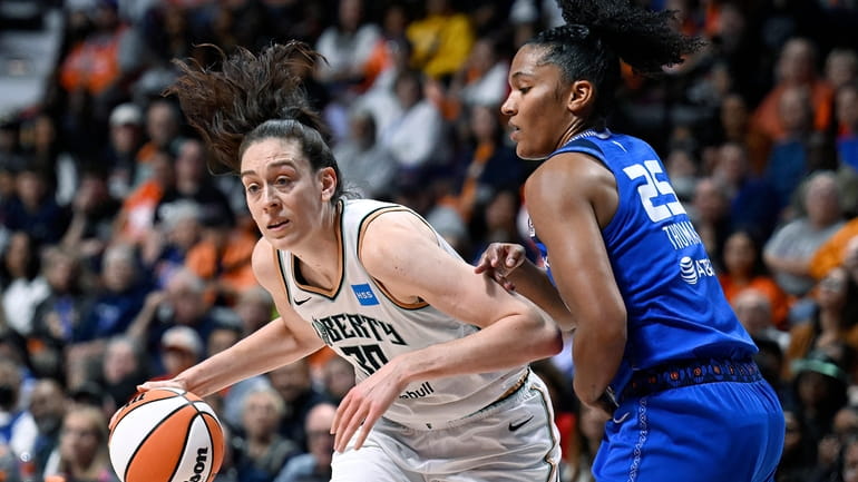 New York Liberty forward Breanna Stewart is guarded by Connecticut...