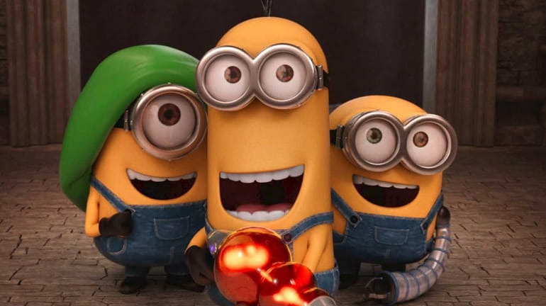 Stuart, Kevin and Bob dig their new gadgets in "Minions."